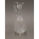 A 19th century glass claret jug, hand chased with fox. 28 cm high.