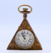 A brass Masonic style pocket watch. 6.5 cm high including suspension loop.