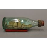 A miniature boat in a bottle. 11 cm long.