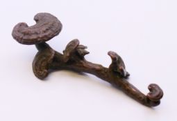 A bronze ruyi sceptre. 10 cm long.