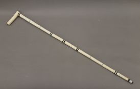An antique Indian horn and bone walking stick. 93 cm long.