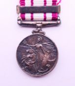 A Malaya silver miniature medal. 1.75 cm diameter.