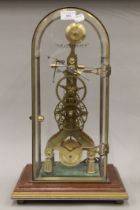 A brass skeleton clock. 52 cm high.