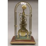 A brass skeleton clock. 52 cm high.