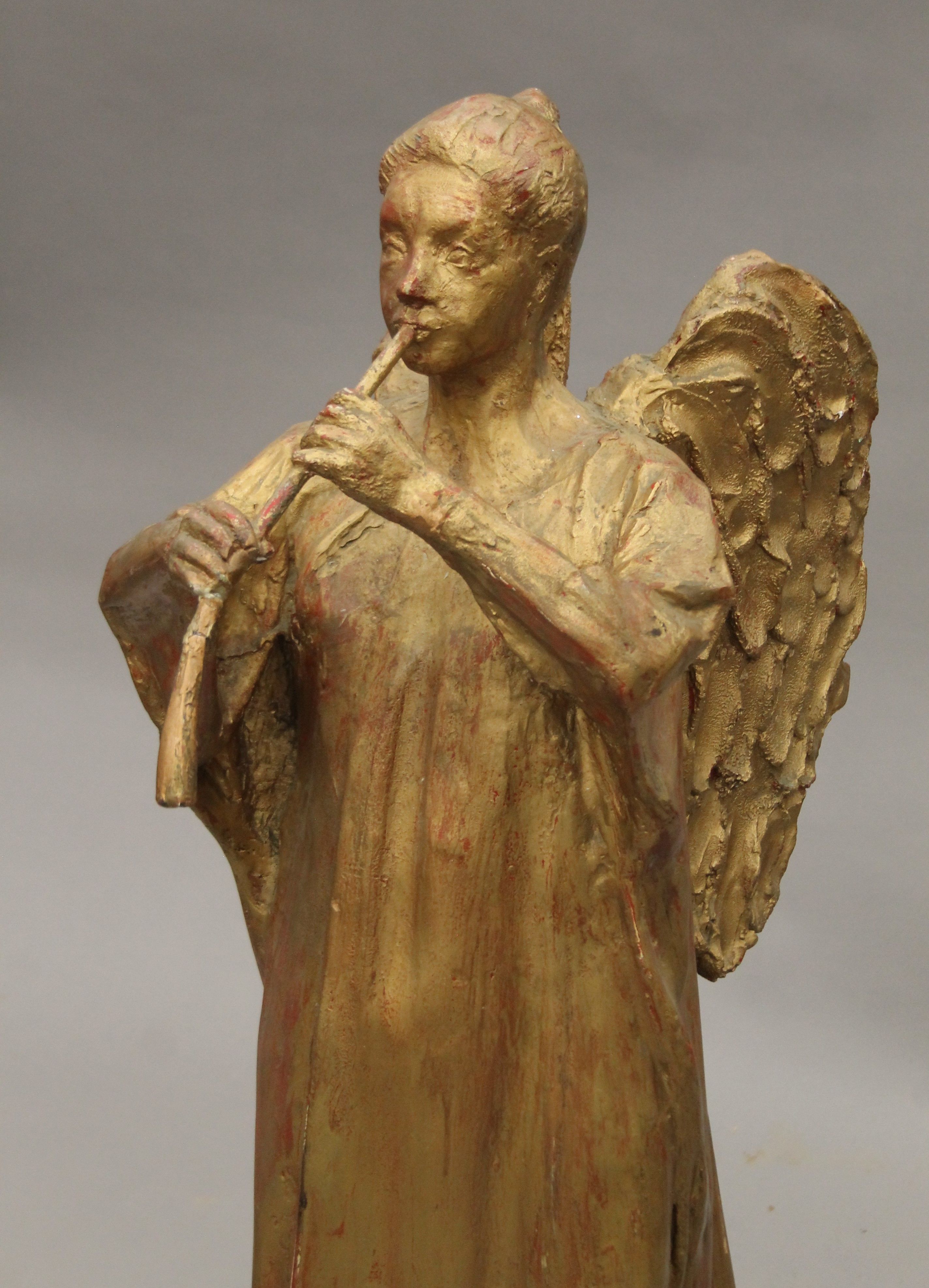 A gilt-painted sculpture of an angel mounted on a composite stone plinth base. 105 cm high. - Image 2 of 4