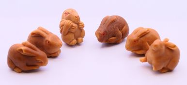 Six netsukes in the form of hares. Tallest 3 cm high.