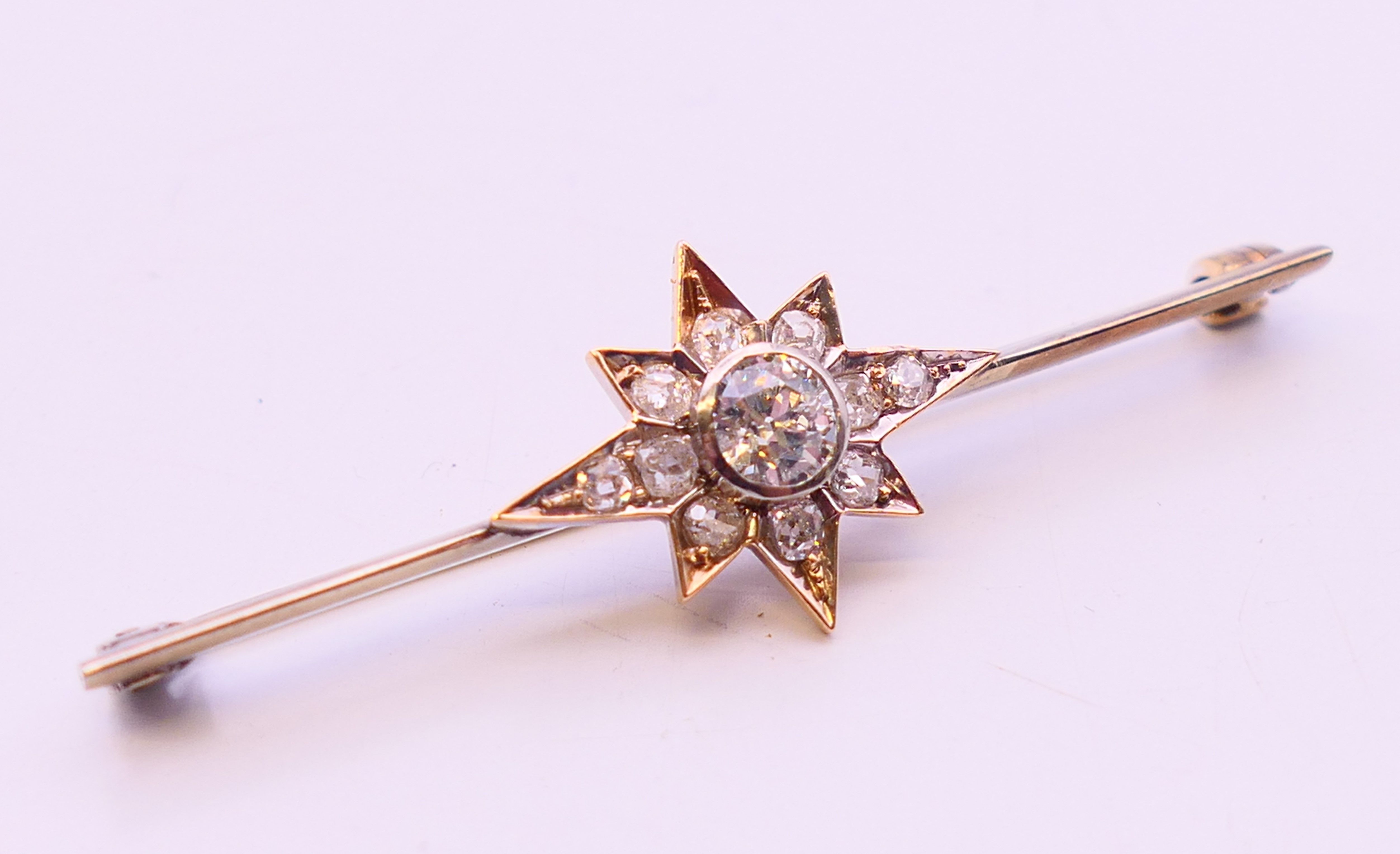 An antique bar brooch with diamond set star design, the central diamond approximately 0.5 carat. - Image 3 of 7