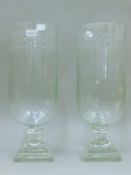 A pair of cut glass hurricane lamps. 39.5 cm high.