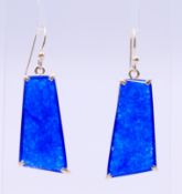 A pair of silver and blue stone earrings. 3 cm high.