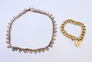 A white metal (low grade silver) collar necklace and a rolled gold curb link padlock bracelet.