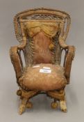 A Victorian model chair. 31 cm high.
