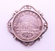 A brooch set with a medallion inscribed 'From the people of Natal presented to HMS Natal 1915'. 3.