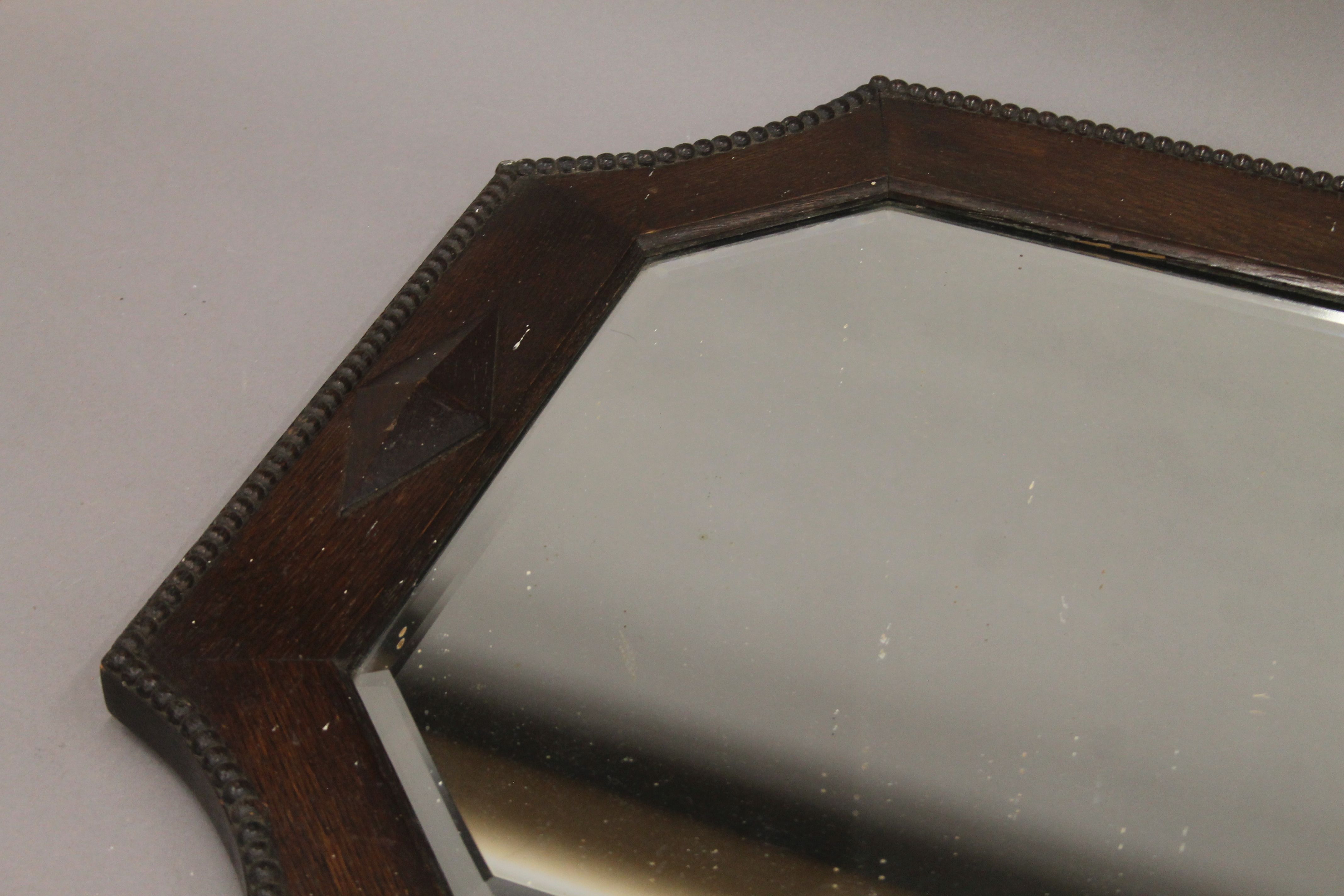 An early 20th century oak-framed bevelled mirror. 80 cm wide. - Image 2 of 3