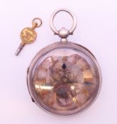 A large Victorian silver pocket watch. 6 cm diameter.