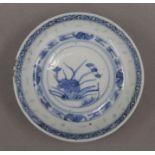 A 19th century Chinese blue and white dish with rice grain decoration and four-character mark to