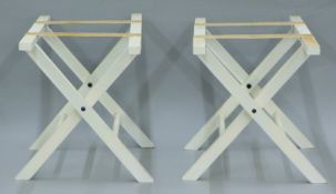 Two white painted luggage stands. Each 60 cm wide.