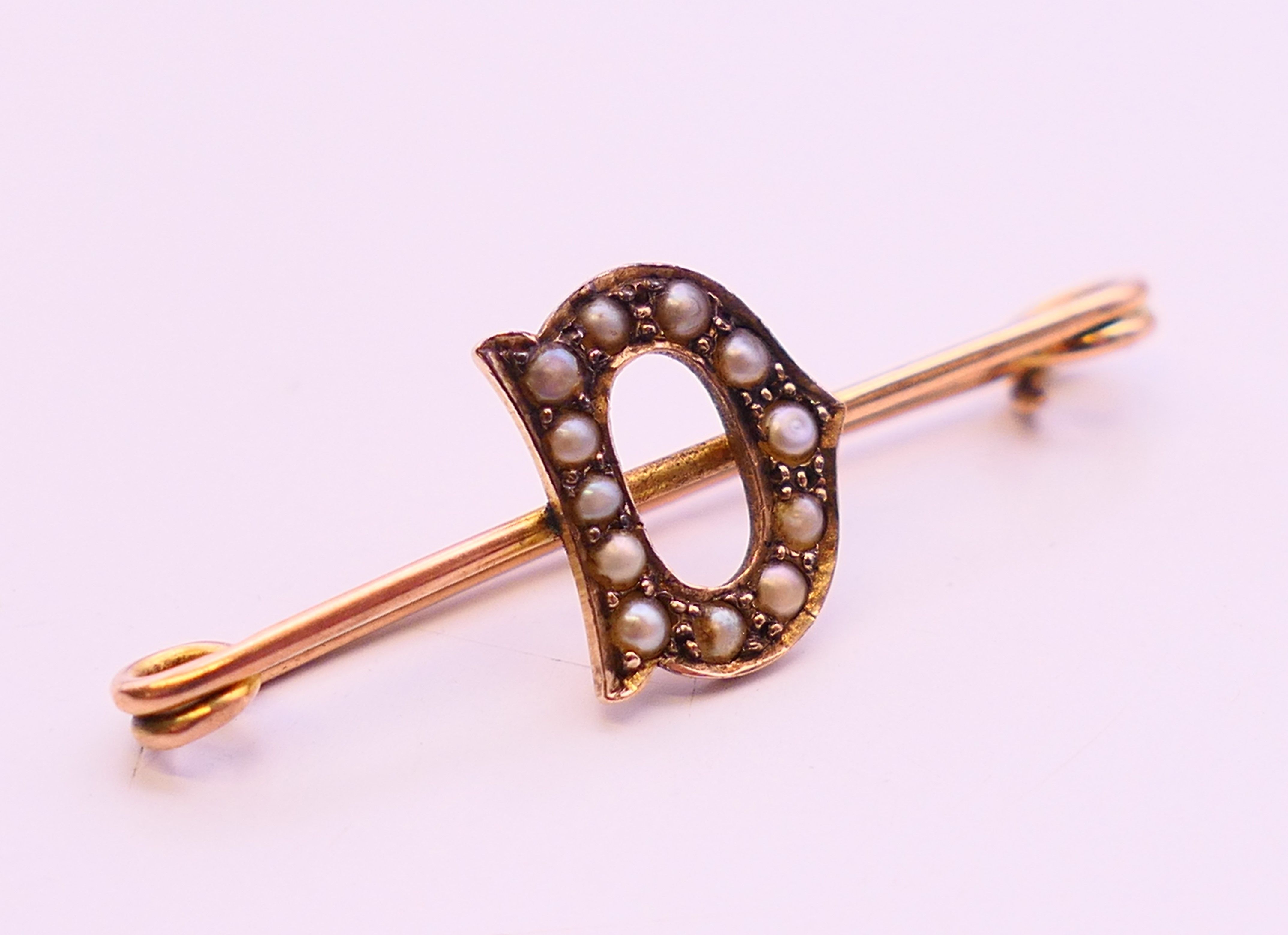 Three 9 ct gold brooches, one with pearls set within a 'D', all boxed. The largest 6 cm long. 5. - Image 3 of 14