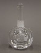 A signed Orrefors of Sweden glass scent bottle. 10 cm high.