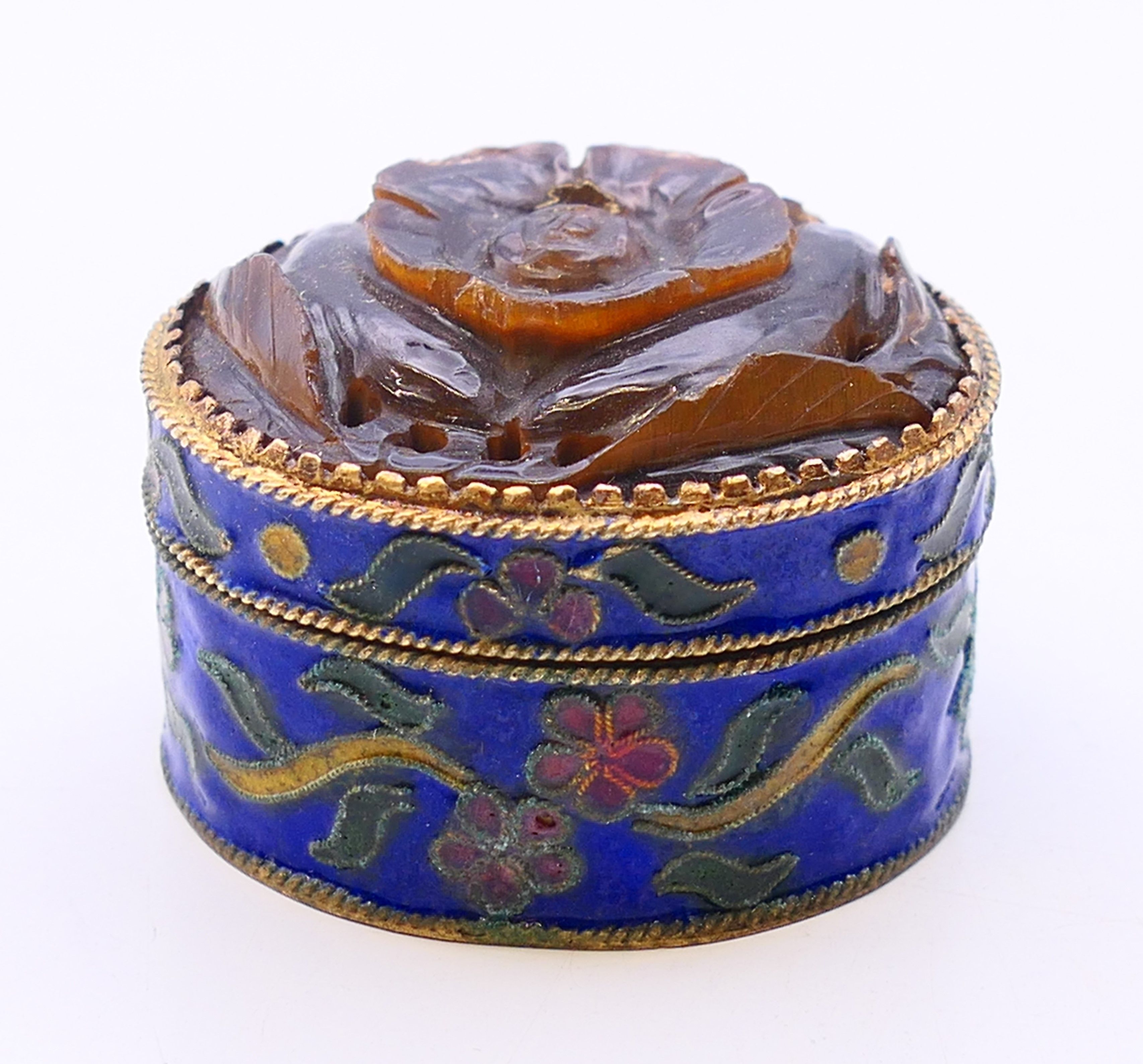 A Chinese cloisonne and tiger's eye box. 3 cm high.