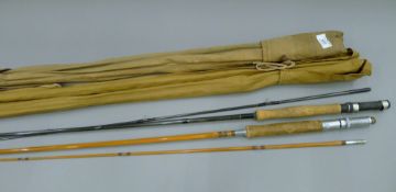 A Henry Aiken of London split cane rod, two other split cane rods and a carbon fibre rod.