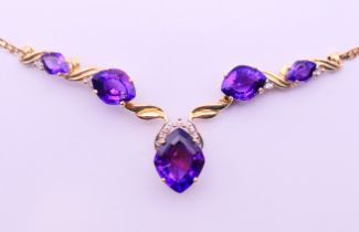 A 14 K gold and amethyst necklace. 45 cm long. 9.4 grammes total weight.