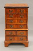 A small yewwood chest of drawers. 42 cm wide x 76 cm high.