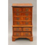 A small yewwood chest of drawers. 42 cm wide x 76 cm high.