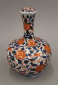 A 19th century Imari vase with lid. 22 cm high.