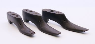Three 19th century carved slate shoes. Two 10.5 cm long, one 9 cm long.