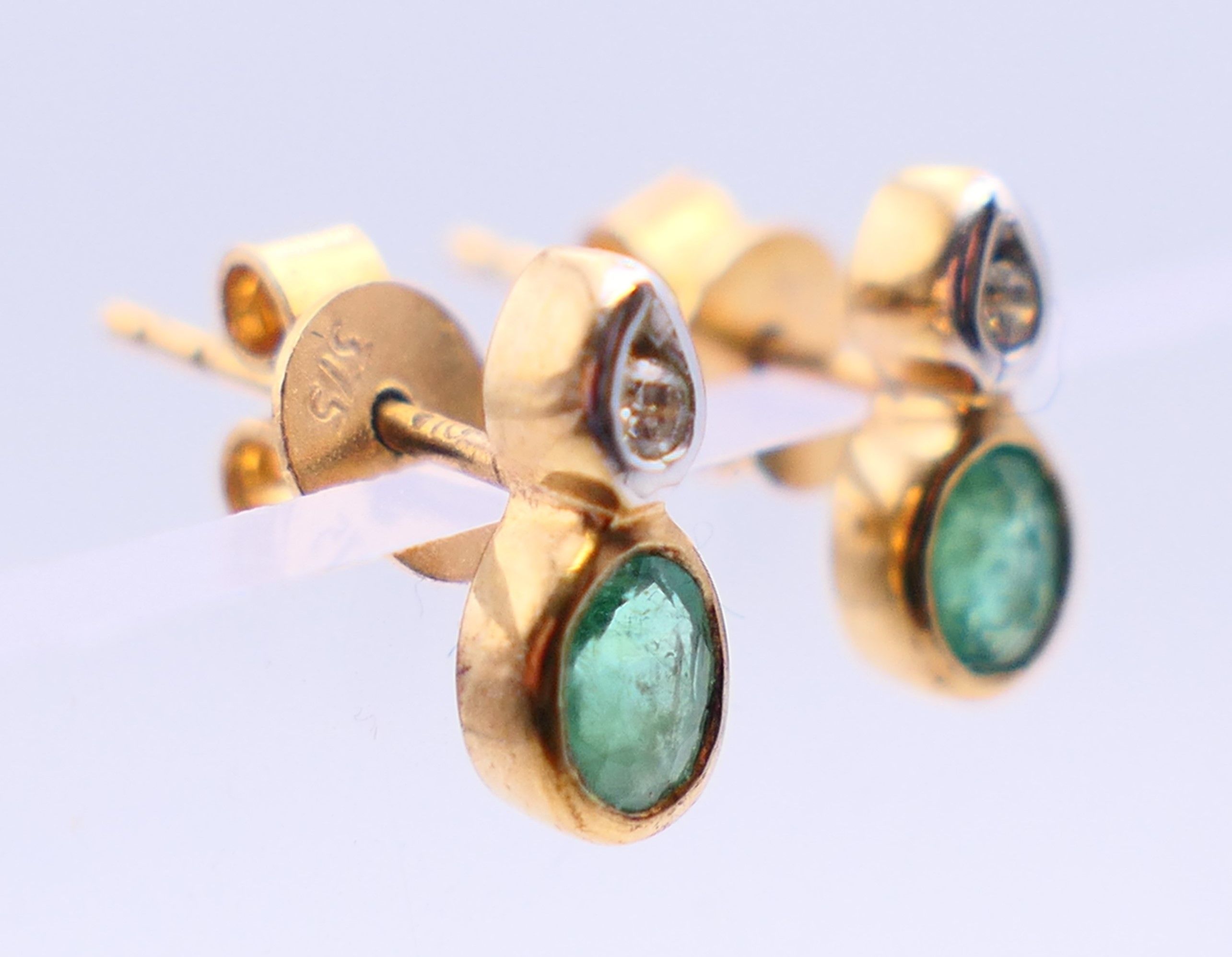 A pair of 9 ct gold earrings set with diamonds and emeralds. 0.75 cm high. - Image 3 of 4