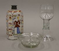 An 18th century Silesian glass flask brightly decorated with a lady with wine glass in hand,