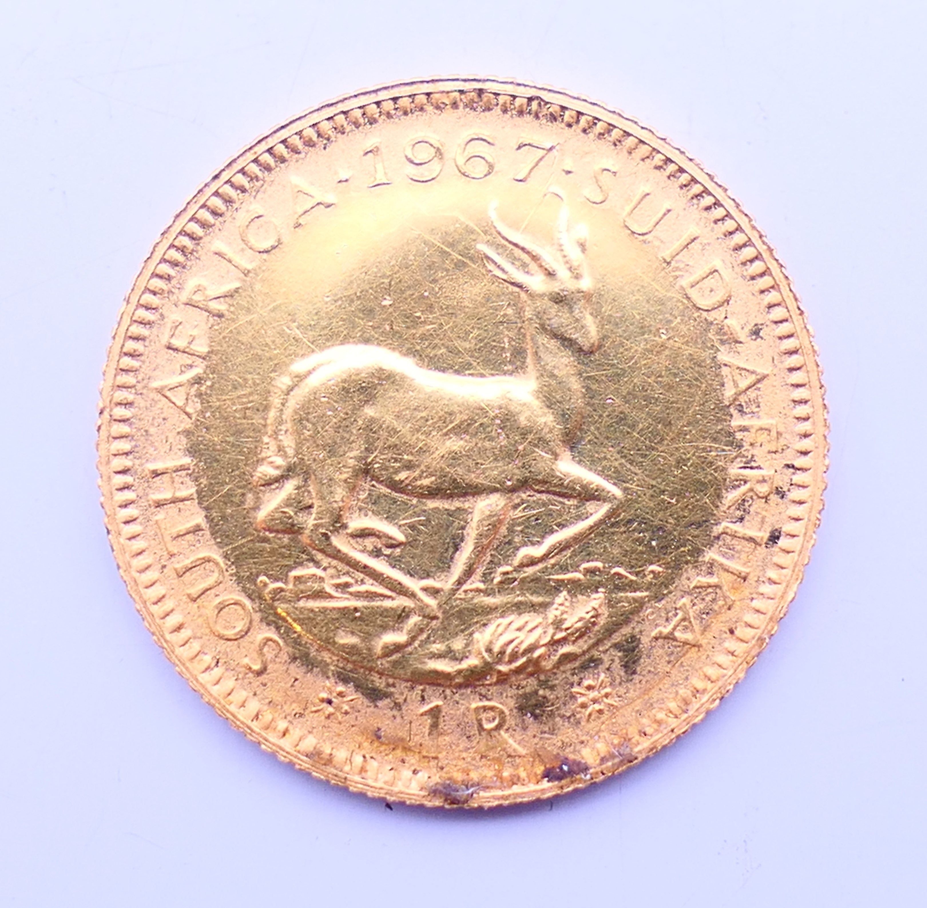 A 1967 South African 1 rand gold coin. - Image 3 of 4