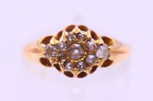 An 15 ct gold diamond set ring. Ring size O.