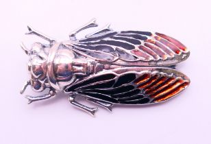 A silver brooch in the form of a moth. 5 cm x 3 cm.