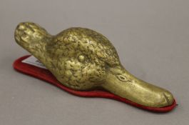 A brass duck's head-form letter clip. 18 cm long.