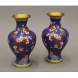 A pair of early 20th century prunus pattern cloisonne vases. 18.5 cm high.