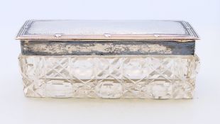 A cut-glass trinket box with silver lid, hallmarked Birmingham 1906. 9 cm x 3 cm.