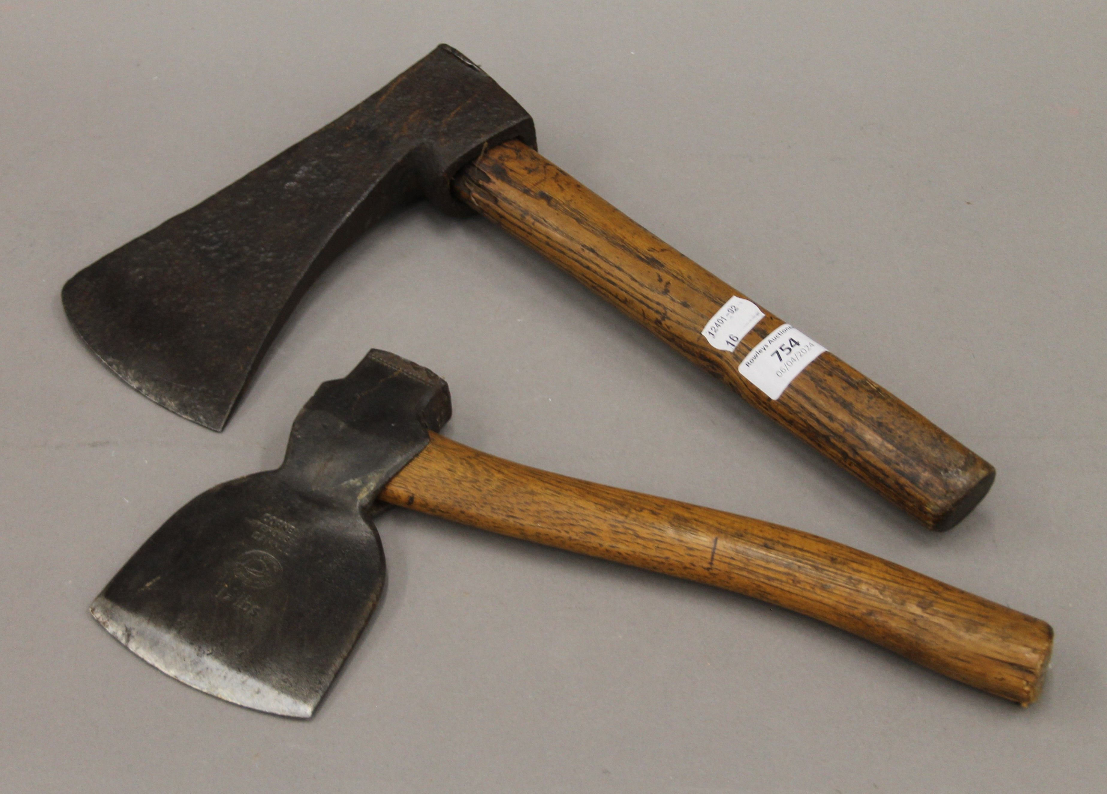 Two antique axes. The largest 33 cm high.