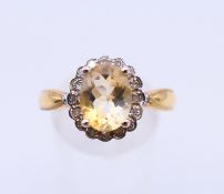 A 9 ct gold, diamond and citrine ring. Ring size S.