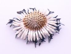 A silver sunflower brooch. 5 cm x 3.5 cm.