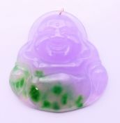 A purple and green jade Buddha pendant with gold suspension loop. 5 cm high.
