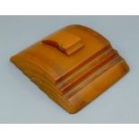 An Art Deco amber bakelite inkstand. 17.5 x 15.5 cm.