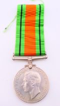 A WWII 1939-45 Defence medal. 3.75 cm diameter.