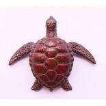 A bronze turtle. 6 cm x 5 cm.