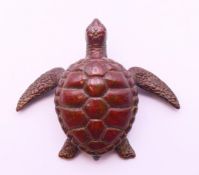 A bronze turtle. 6 cm x 5 cm.