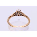 A 9 ct gold and diamond solitaire ring. Ring size O/P.