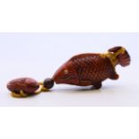 An inro formed as fish with a smaller fish netsuke. Largest fish 12 cm long.
