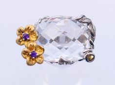 A large silver crystal and flower ring. Ring size R/S.