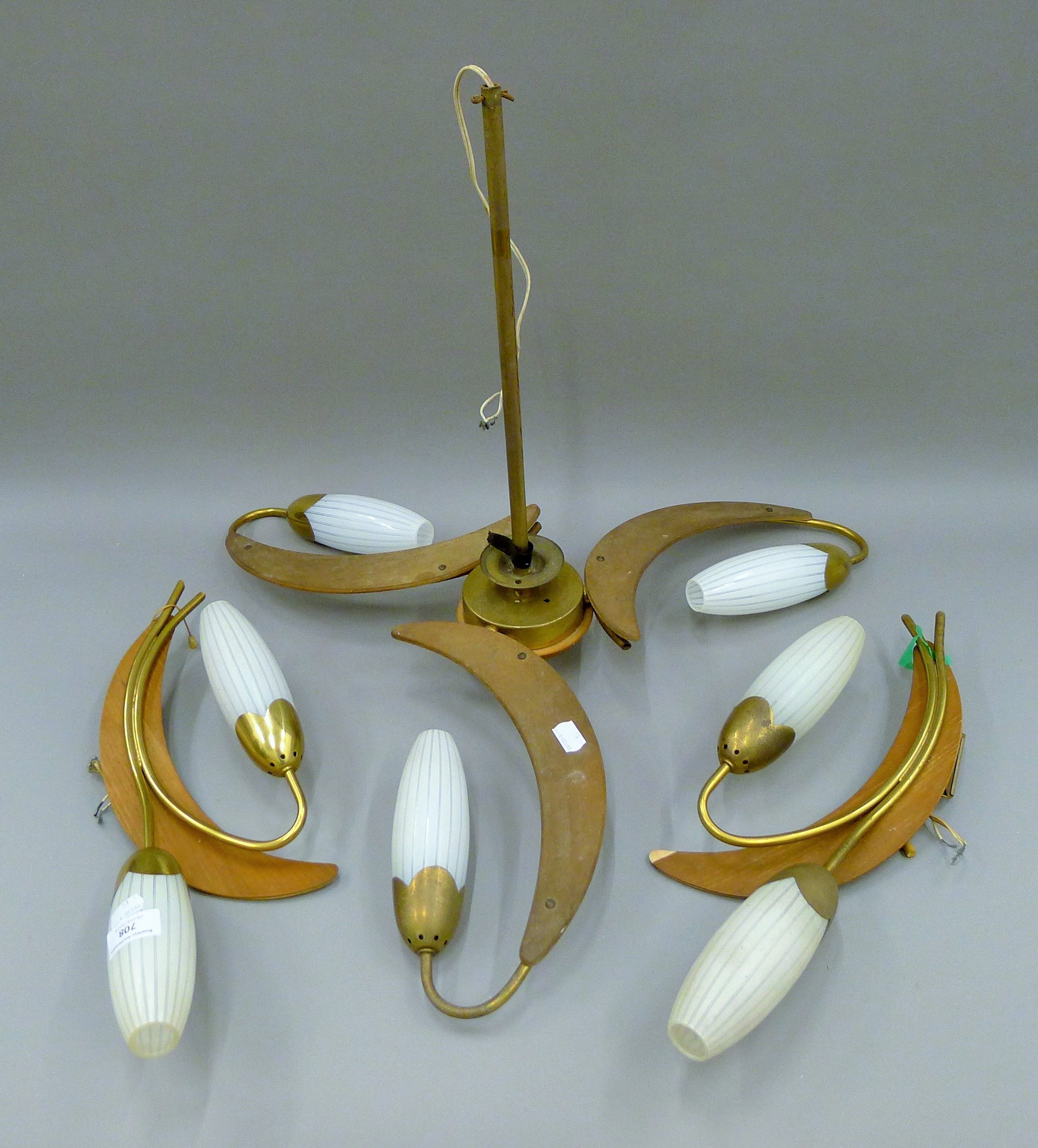 A mid-20th century ceiling light and two matching wall lights together with two modern ceiling