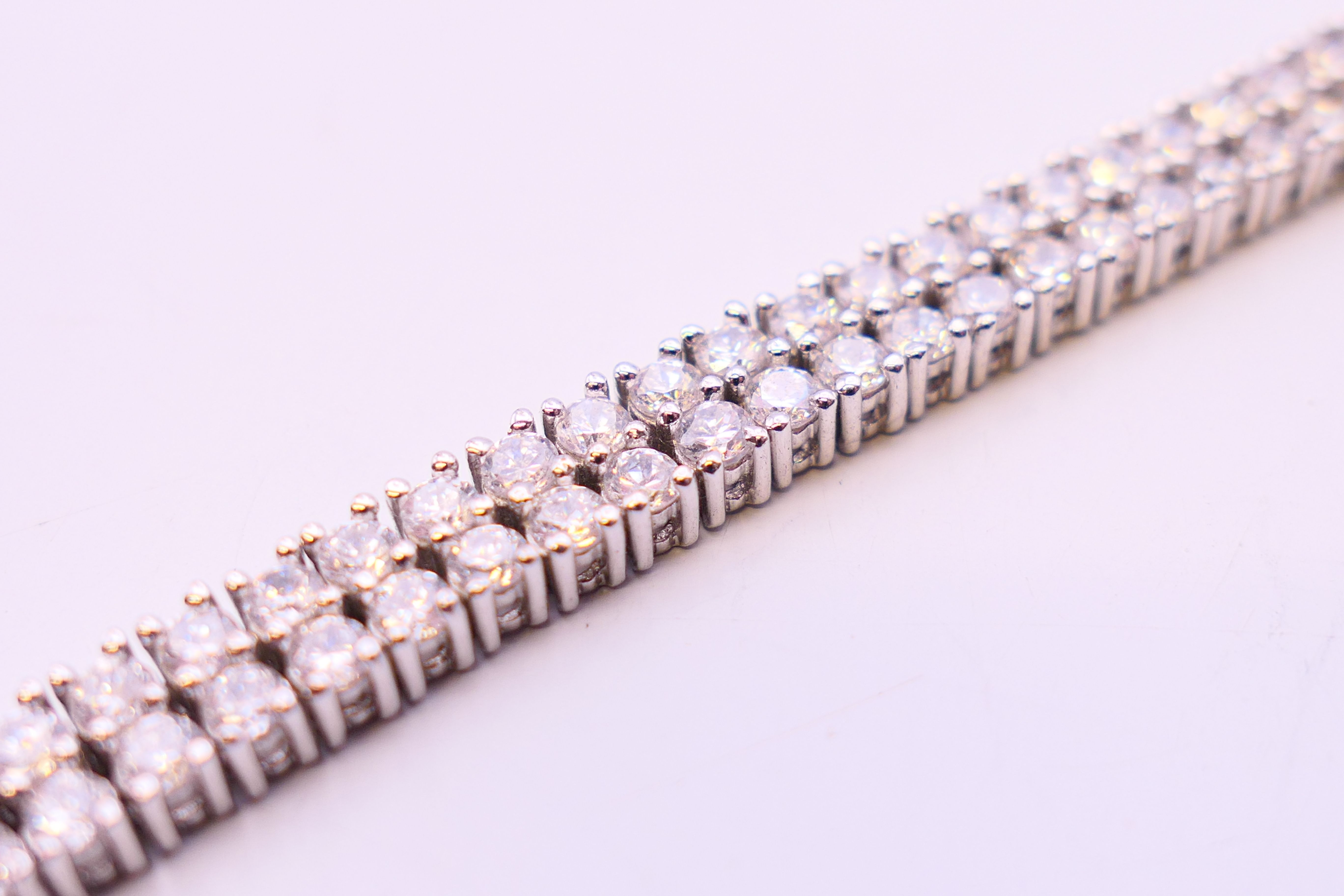 A silver cubic zirconia line bracelet. 20 cm long. - Image 4 of 5